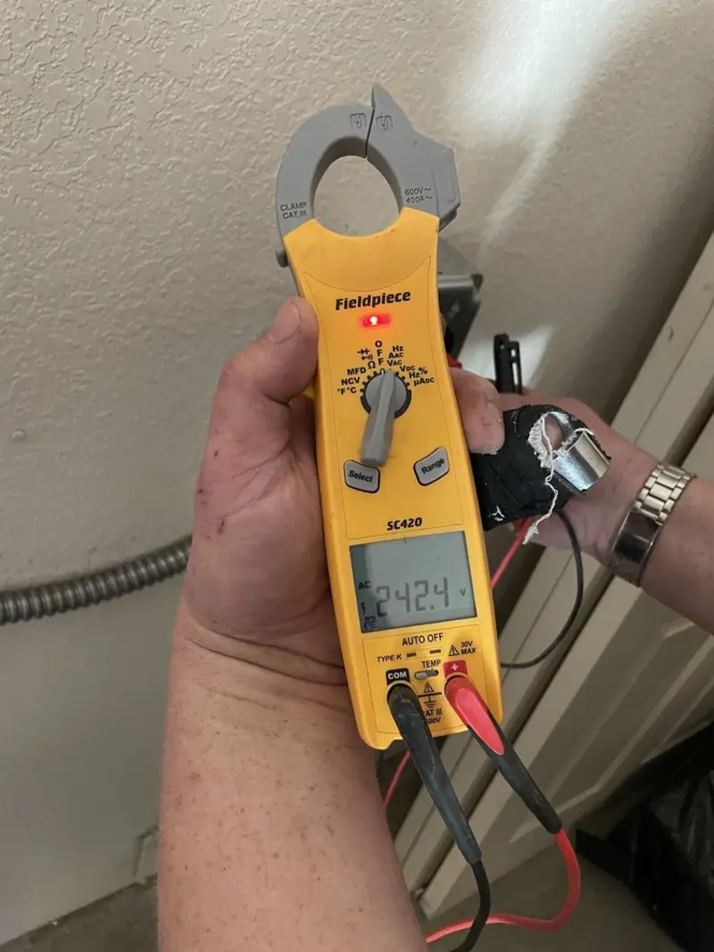Voltage testing with clamp meter during Generator Installation in Town 'n' Country